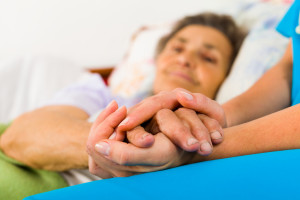 Caring Nurse Holding Hands